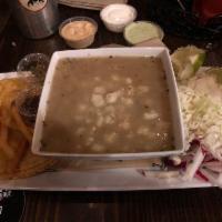 Chicken Pozole Soup · Fresh chicken broth, with homony and shredded chicken. Side of cabbage,reddish, onions,orega...