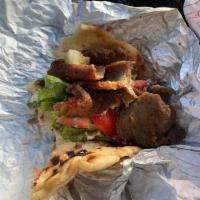 Gyro Sandwich · Shaved lamb with lettuce, onions, tomatoes, pickles and tzatziki sauce.