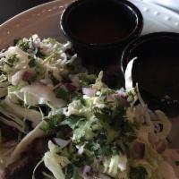 Short Rib Tacos · Slow braised short rib with green chilis, cheese blend, fresh salsa, cabbage, and cilantro c...