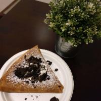 Oreo Cheesecake Crepe · Served with a dollop of whipped cream.