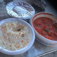 Butter Chicken · Chicken pieces roasted in a clay oven and the folded into a rich creamy tomato sauce with nu...