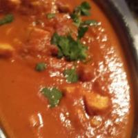 Paneer Makhani · Cubes of homemade cheese cook with cumin scented butter, tomatoes, cashews, raisins and mild...