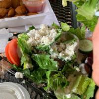 Greek Salad · Romaine lettuce, vine ripe tomatoes, green peppers, red onions, English cucumbers, and Kalam...