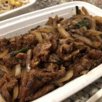 Mongolian Beef · Sliced flank steak stir-fried with onions and green onion served over crispy cellophane nood...