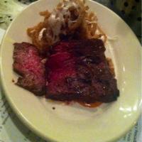 Grilled Skirt Steak · Manchego, onions rings, mojo Colorado.
