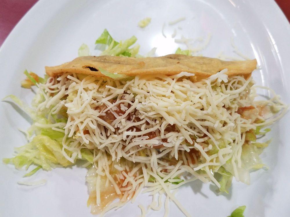 Shredded Beef Crispy Taco · Lettuce, cheese and tomato sauce.