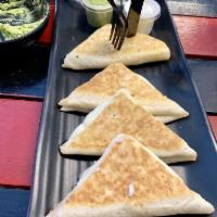 Cheese Quesadilla · Served in a flour or whole wheat tortilla with melted mozzarella cheese and pico de gallo. I...