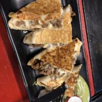 Grilled Steak Quesadilla · Served in a flour or whole wheat tortilla with melted mozzarella cheese and pico de gallo. I...