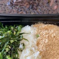 Feijoada Completa · Black bean stew with fresh and smoked pork and beef served with collard greens, rice.