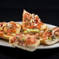 Bruschetta · Baked bread, olive oil, tomatoes, cut garlic, green onions, and basil.
