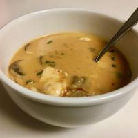 Tom Ka Gai Soup · Traditional Thai creamy hot and sour soup in a coconut milk broth with chicken, lemongrass, ...