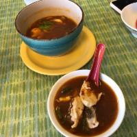 Tom Yum Gai Soup · Traditional Thai clear broth hot and sour soup with chicken, lemongrass, kaffir leaves and g...