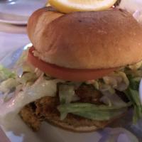 Crab Cake Sandwich · Maryland style. Served on a brioche bun with lettuce, tomato and remoulade sauce. Served wit...