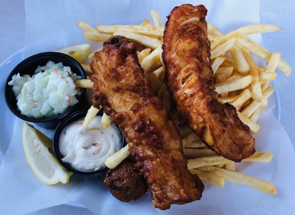 Fish and Chips · Fried Icelandic cod served East Coast style over a mound of fries. Served with hush puppies, a side of homemade coleslaw and tartar sauce.