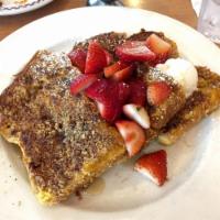 French Toast · 3 slices of our homemade challah bread, dipped in our special batter and grilled a golden br...