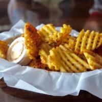 Trolley Chips · Cross-cut masa battered waffle fries tossed in your choice of cajun dust or garlic parmesan....