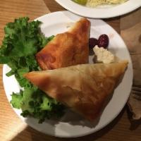 Spanakopita · Homemade and authentic. Flaky phyllo dough stuffed with spinach, onions, feta cheese and her...
