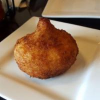 Chicken Croquette · Popular Brazilian snack made with a potato mix dough filled with shredded chicken and spices.