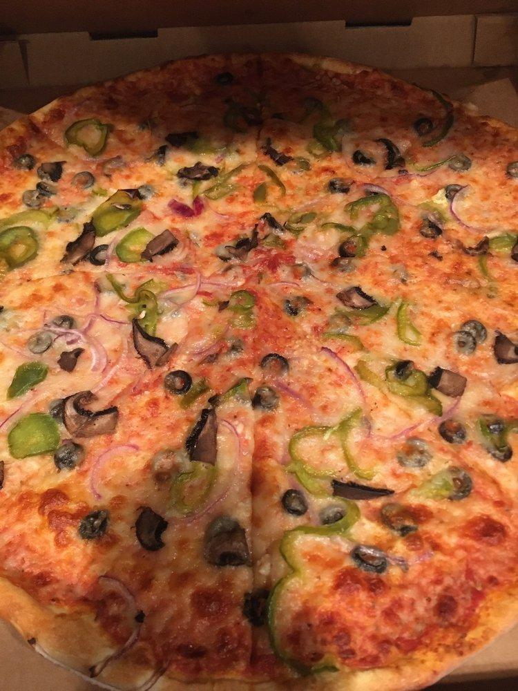 Veggie Pizza · Flippin' pizza sauce, 100% milk mozzarella, green bell pepper, red onion, black olives, sliced mushrooms and fresh garlic.