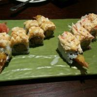 Snow Mountain Roll · Shrimp tempura, cucumber inside, topped with crab meat and snow mountain sauce