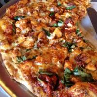 Buffalo Chicken Pizza · Light tomato sauce, mozzarella cheese, spicy chicken breast, mushrooms, red onions and sun-d...