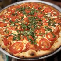Margherita Pizza · Pizza sauce, mozzarella, basil, fresh tomato and garlic-infused oil.