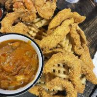 Louisiana Combo · Fried shrimp, fried catfish, waffle fries, hush puppies, crawfish etouffee.