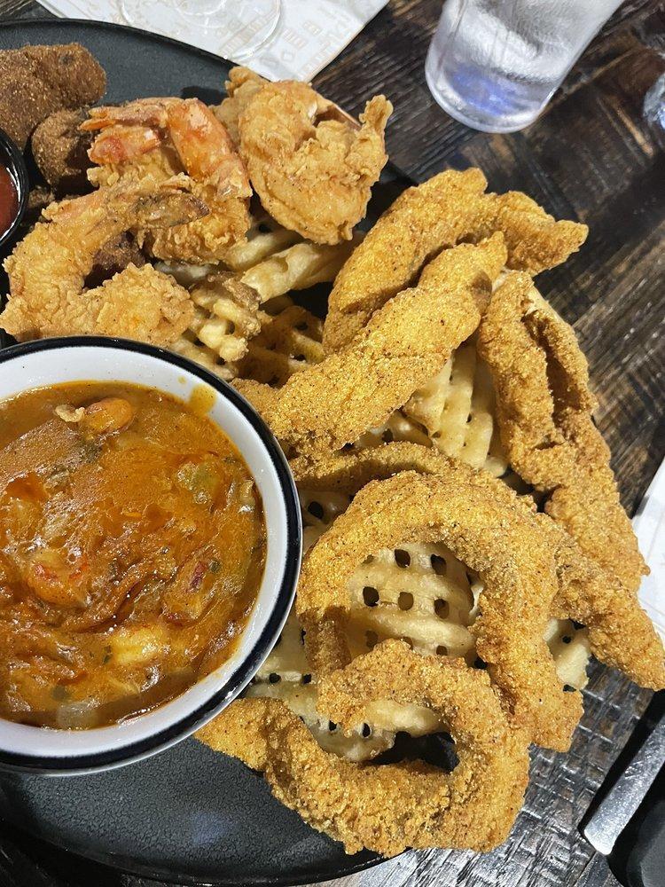 Louisiana Combo · Fried shrimp, fried catfish, waffle fries, hush puppies, crawfish etouffee.