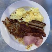 Country Boy Breakfast · 3 farm fresh eggs, ham, bacon, sausage links, golden hash browns or fresh fruit, toast and j...