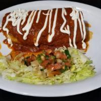 Wet Burrito · Beans, rice and your choice of meat, topped with homemade red enchilada sauce, sour cream, a...