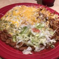 Huevos Rancheros · Corn or flour tortillas, 2 eggs any style, hash browns and beans smothered in red or green c...