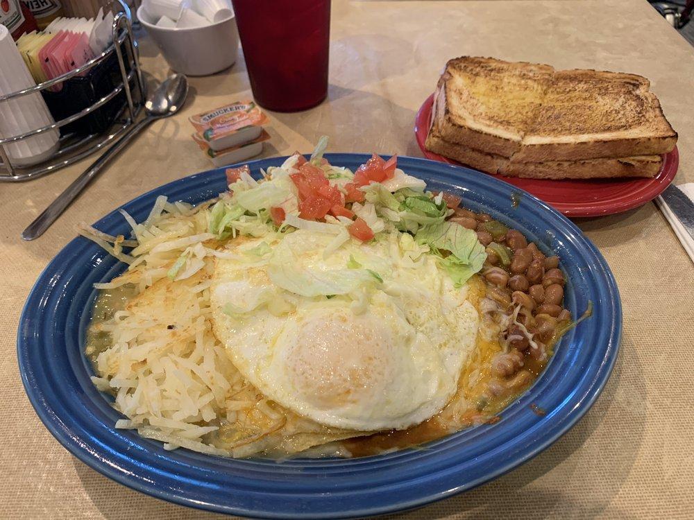 Breakfast Enchiladas · Enchiladas, hash browns, beans, with red or green chile, topped with 2 eggs any style, cheddar and Jack cheese with choice of meat.