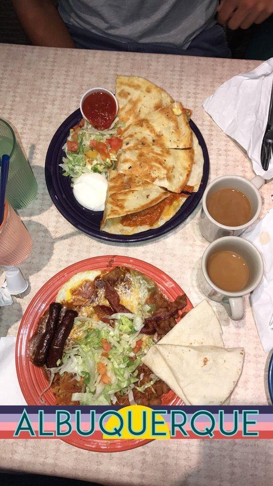 Breakfast Quesadillas · A large grilled flour tortilla filled with scrambled eggs, hash browns, green chile, cheddar and Jack cheese, served with salsa and sour cream with choice of meat.