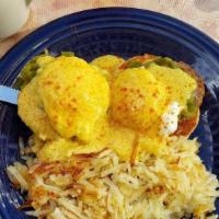 Southwest Eggs Benedict · Hollandaise sauce green chile, sausage patty, 2 poached eggs and hash browns.