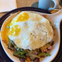 Ultimate Skillet with Wheat Toast · Bacon, sausage, ham, onion, bell pepper and mushrooms, 2 eggs and choice of chile and cheese...