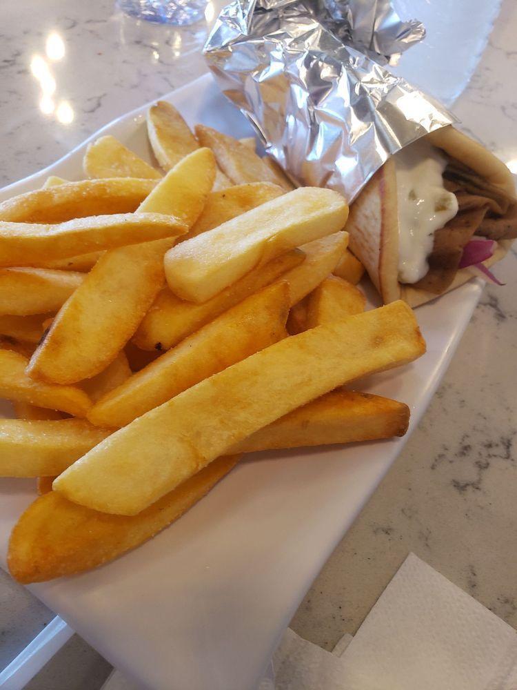 Gyro · Gyro, tomato, onions and Greek tzatziki sauce. Served with fries and choice of drink.