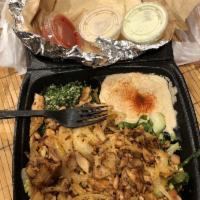 Chicken Shawarma Plate · Chicken Shawarma, Grilled onions, Salad, Rice , 1 Pita & 2 sides


* ask for a side of pickl...