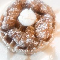 Chicken and Waffle · Crispy fried all white meat chicken tenders served on a Belgian waffle with powdered sugar, ...