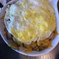 Country Skillet · Home fried potatoes sauteed with diced ham, bell peppers and onions. Topped with cheddar che...