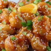 Orange Chicken · 14 oz. light breaded chicken breast sauteed in a spicy orange sauce. Served with brown rice ...