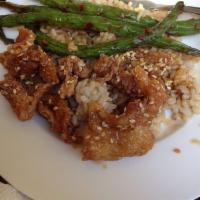 Sesame Chicken · 14 oz. light breaded chicken breast sauteed in honey soy sauce, vinegar and wine sauce. Serv...