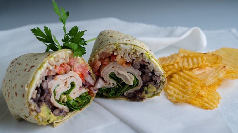 California Wrap · Southwest chipotle tortilla, oven roasted turkey, organic black beans, Swiss cheese, organic brown rice, tomatoes, avocado, red onion, spinach, mustard and mayo.