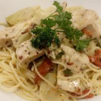 Chicken Piccata · Sauteed in a light white wine sauce with sundried tomatoes and artichokes in a lemon butter ...
