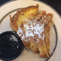 French Toast · Thick slices of egg bread, dipped in special egg batter, then carefully grilled. Dusted with...