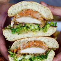 Pollo Chi Jao Kai Sandwich · Oriental marinade crispy fried chicken thigh with pickled turnip and carrots served on our h...