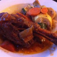 Baked Lamb Shanks Dinner · 2 shanks. Served with 2 hot sides and a small Greek salad.
