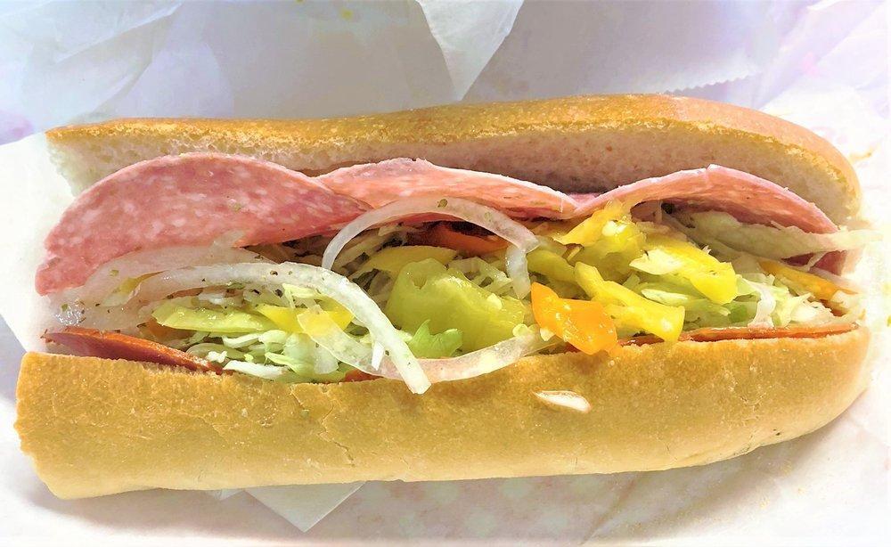 Italian Grinder · Salami, capicola, pepperoni, provolone and American cheese, lettuce, tomatoes, onions, banana peppers, oregano and oil and vinegar.