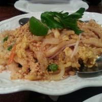 Chicken Pad Thai · Thick noodles with scrambled egg, bean sprouts, onion, and ground peanuts.
