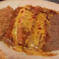 Cheese Enchiladas · Topped with chili gravy and cheese. Served with Spanish rice and refried beans.