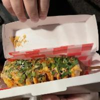 Dusty Dog · Corn battered frank on a stick. Mustard, spicy mayo, cilantro-scallion, fried shallots and t...